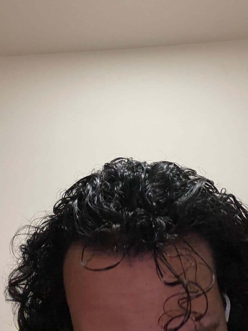 Back of the head showing the full curly hair, fresh and organized