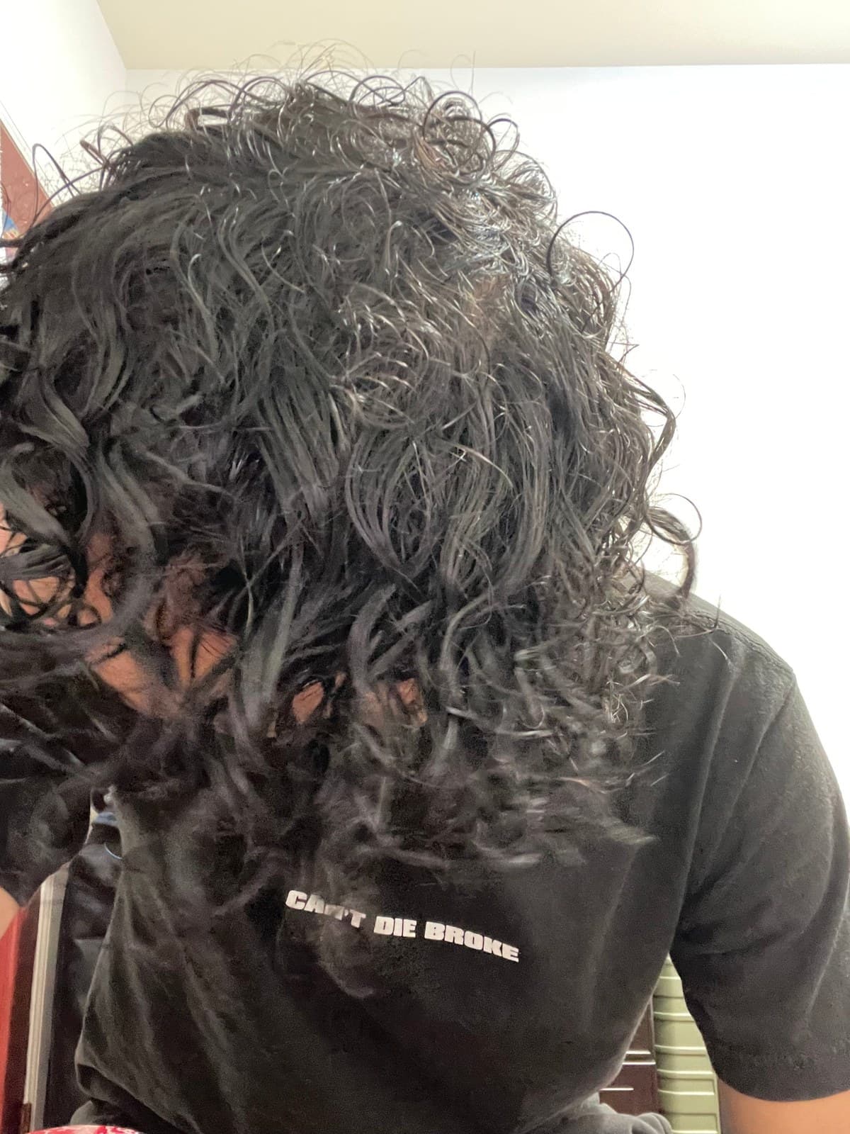 Top of the head with wet, separated curls